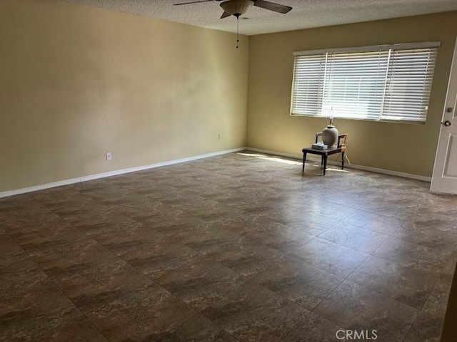 1447 W Westward Ave, Banning, CA 92220 - unfurnished room featuring ceiling fan, a textured ceiling, and baseboards