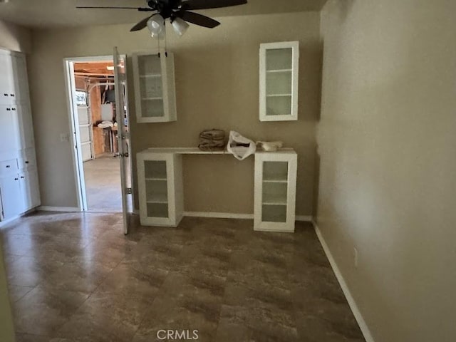 1447 W Westward Ave, Banning, CA 92220 - unfurnished room with baseboards and a ceiling fan