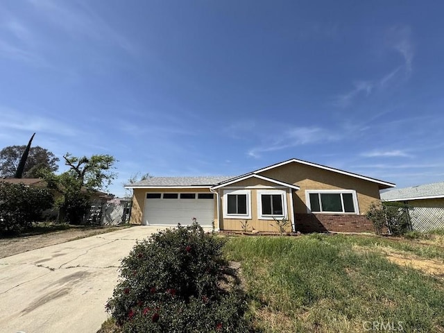 1447 W Westward Ave, Banning, CA 92220 - single story home with an attached garage and driveway