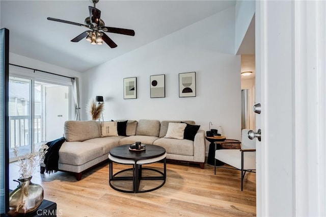 23502 Cambridge Rd Unit 306, Yorba Linda, CA 92887 - living room featuring vaulted ceiling, a ceiling fan, and light wood-style flooring