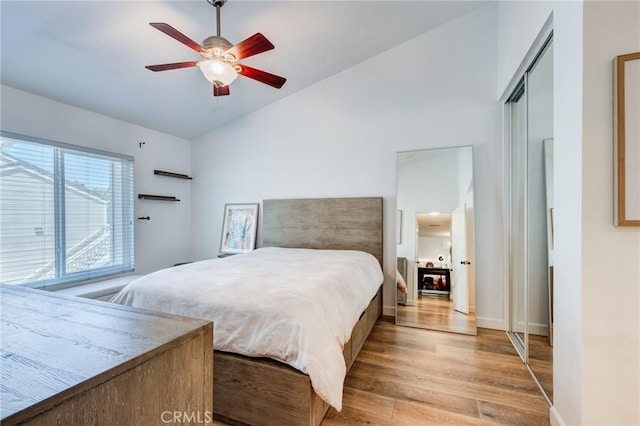 23502 Cambridge Rd Unit 306, Yorba Linda, CA 92887 - bedroom featuring light wood finished floors, vaulted ceiling, baseboards, and ceiling fan