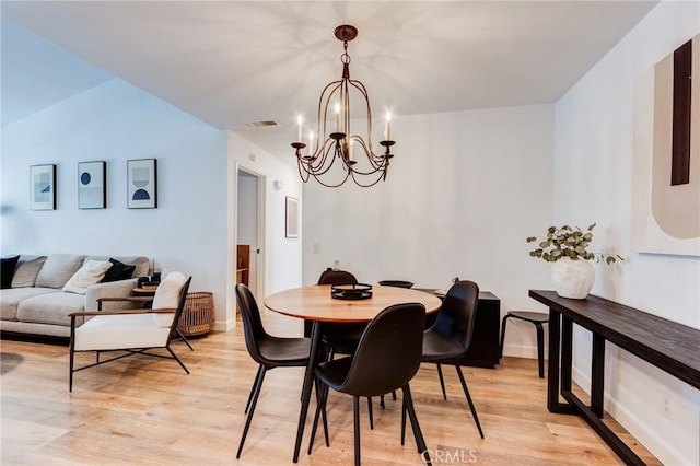 23502 Cambridge Rd Unit 306, Yorba Linda, CA 92887 - dining room with a chandelier, light wood-style floors, and baseboards