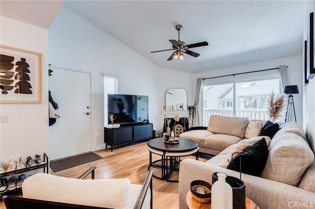 23502 Cambridge Rd Unit 306, Yorba Linda, CA 92887 - living room featuring vaulted ceiling, light wood-type flooring, and a ceiling fan
