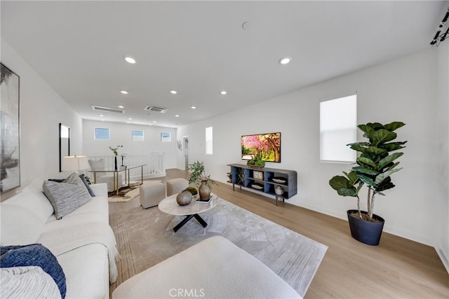 119 Zawn, Irvine, CA 92618 - living room featuring wood finished floors, recessed lighting, and baseboards