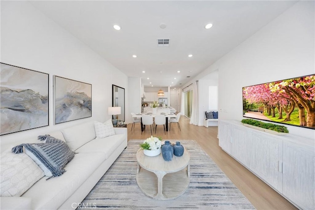 119 Zawn, Irvine, CA 92618 - living area featuring light wood finished floors and recessed lighting