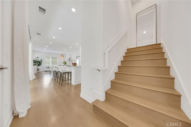 119 Zawn, Irvine, CA 92618 - stairway with wood finished floors and recessed lighting