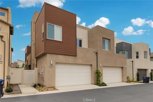 119 Zawn, Irvine, CA 92618 - view of front of home featuring stucco siding and an attached garage