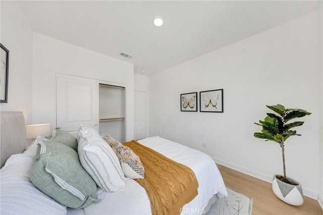 119 Zawn, Irvine, CA 92618 - bedroom with light wood-type flooring, baseboards, and a closet