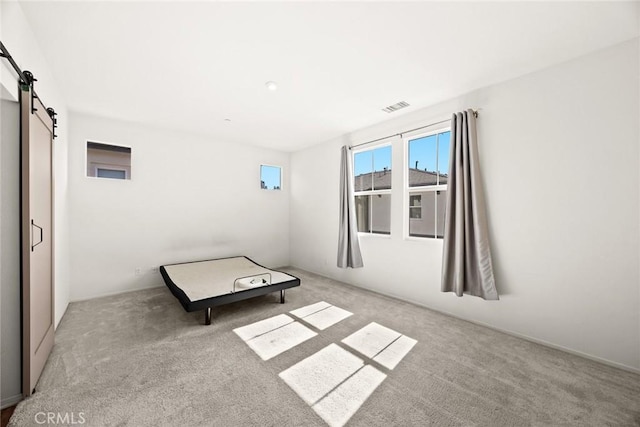 2333 S Via Esplanade Unit 25, Ontario, CA 91762 - unfurnished room featuring a barn door and carpet