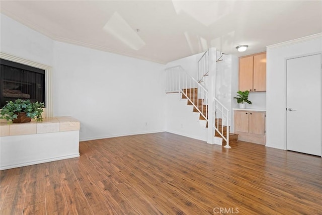 4511 Murietta Ave Unit 8, Sherman Oaks, CA 91423 - unfurnished living room featuring stairs, wood finished floors, crown molding, and baseboards