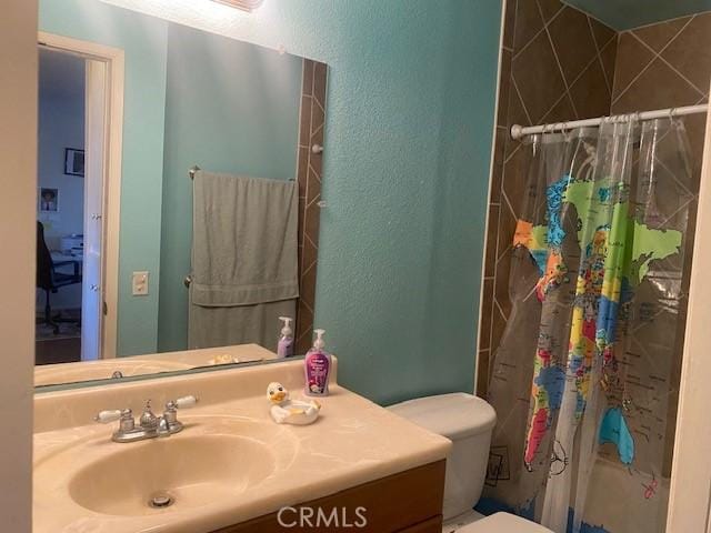 7100 Cerritos Ave Unit 112, Stanton, CA 90680 - bathroom with toilet, vanity, a shower with curtain, and a textured wall