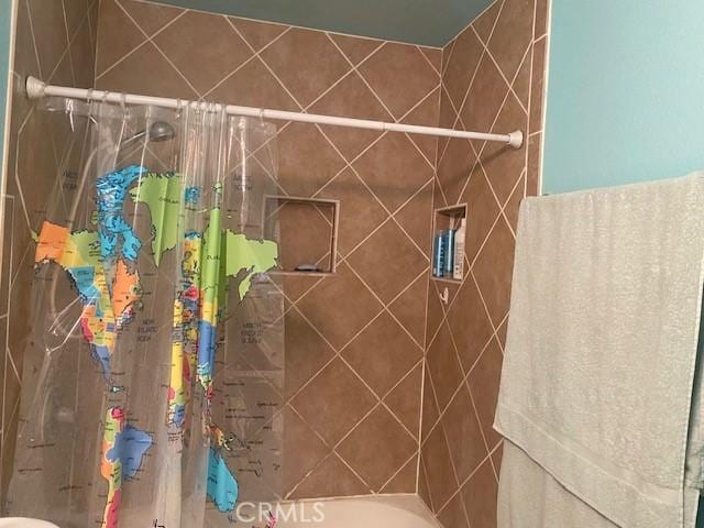 7100 Cerritos Ave Unit 112, Stanton, CA 90680 - bathroom featuring a tile shower