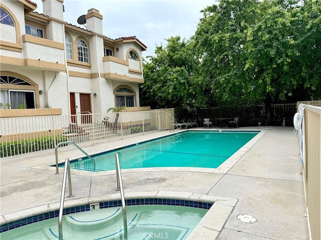 19950 Sherman Way Unit A, Winnetka, CA 91306 - community pool featuring a community hot tub and a patio area