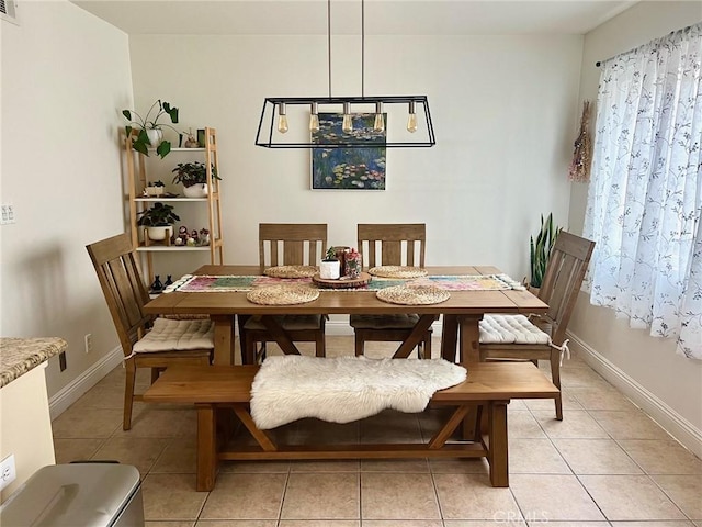 19950 Sherman Way Unit A, Winnetka, CA 91306 - dining space featuring light tile patterned floors and baseboards