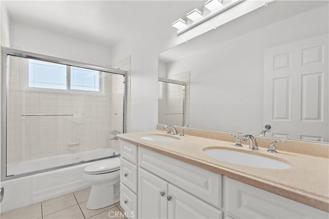 6172 Dalecrest Ave, Woodland Hills, CA 91367 - bathroom with tile patterned floors, toilet, double vanity, and bath / shower combo with glass door