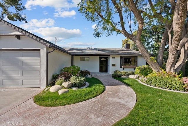 6172 Dalecrest Ave, Woodland Hills, CA 91367 - ranch-style house with a garage, stucco siding, a chimney, driveway, and a front yard
