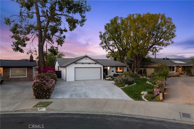 6172 Dalecrest Ave, Woodland Hills, CA 91367 - ranch-style home featuring an attached garage, concrete driveway, and a chimney
