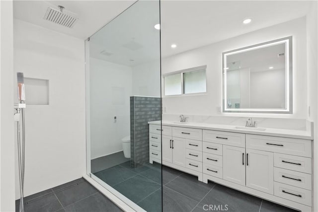 6172 Dalecrest Ave, Woodland Hills, CA 91367 - bathroom featuring double vanity, toilet, tile patterned flooring, a shower, and recessed lighting
