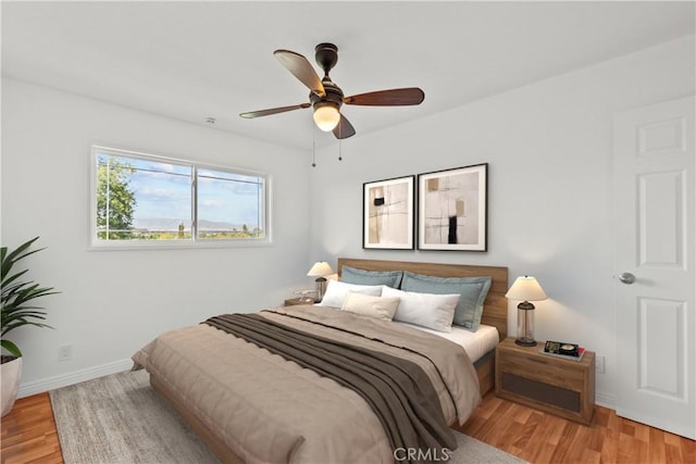6172 Dalecrest Ave, Woodland Hills, CA 91367 - bedroom with light wood-style floors, baseboards, and ceiling fan