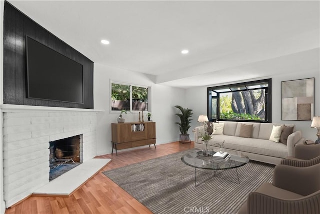 6172 Dalecrest Ave, Woodland Hills, CA 91367 - living room featuring recessed lighting, wood finished floors, and a brick fireplace