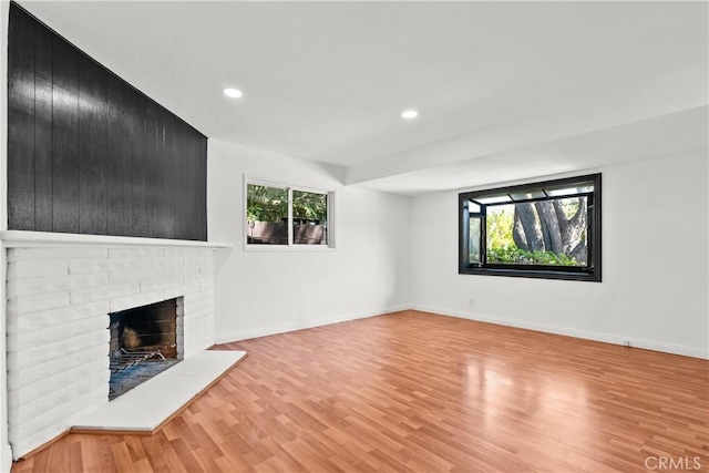 6172 Dalecrest Ave, Woodland Hills, CA 91367 - unfurnished living room with light wood-style floors, recessed lighting, a brick fireplace, and baseboards