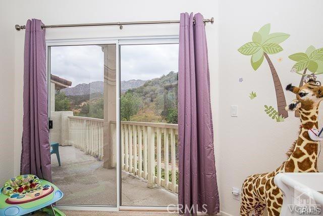 5805 Oak Bend Ln Unit 407, Oak Park, CA 91377 - doorway to outside with a mountain view and carpet floors