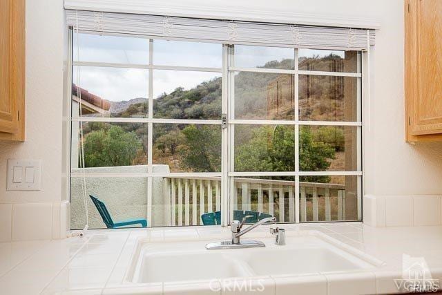 5805 Oak Bend Ln Unit 407, Oak Park, CA 91377 - kitchen view of a sink and tile counters