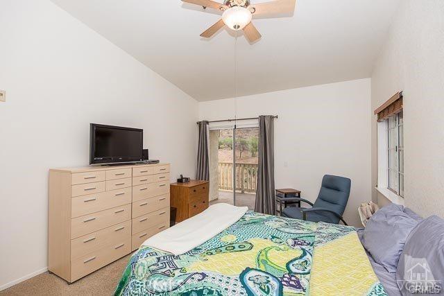 5805 Oak Bend Ln Unit 407, Oak Park, CA 91377 - bedroom featuring access to outside, light carpet, lofted ceiling, and ceiling fan
