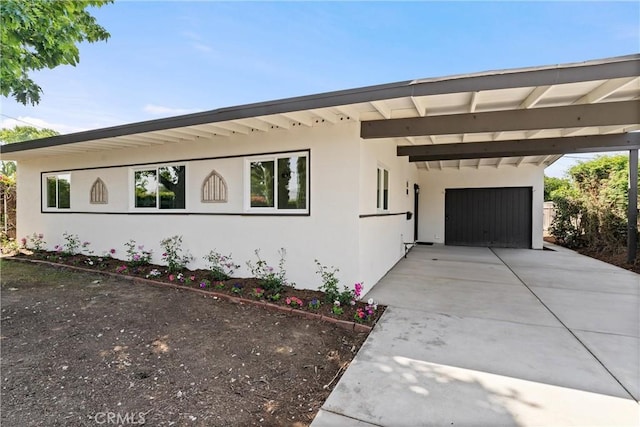 17924 E Kelby St, Covina, CA 91722 - view of front of home featuring concrete driveway, a carport, and stucco siding