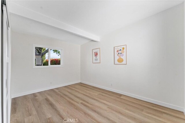 17924 E Kelby St, Covina, CA 91722 - empty room with light wood-style floors, baseboards, and beamed ceiling