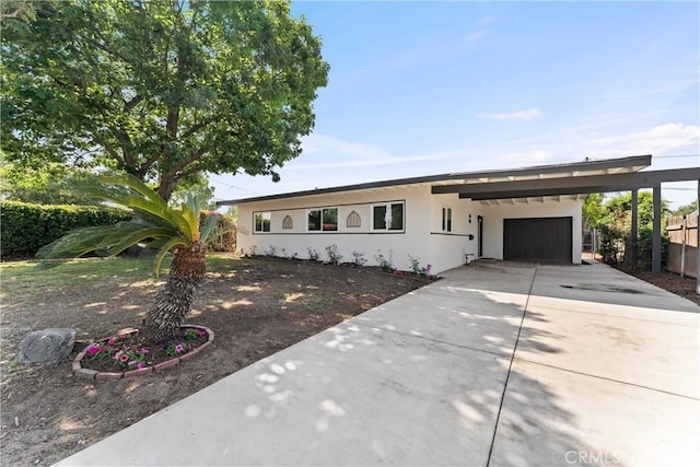 17924 E Kelby St, Covina, CA 91722 - single story home with a carport, concrete driveway, stucco siding, and a garage