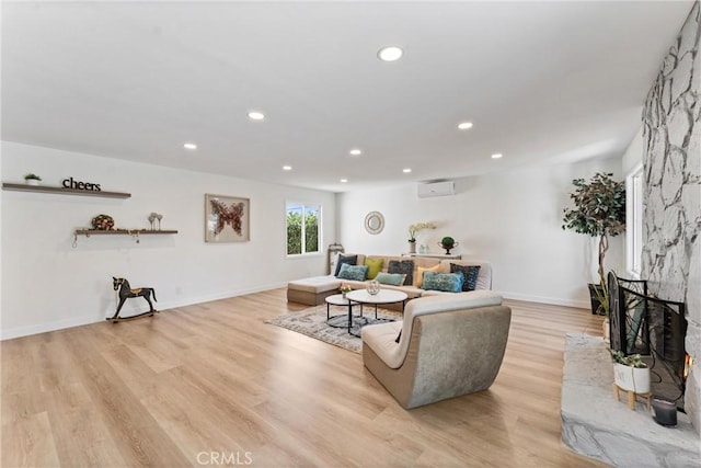 17924 E Kelby St, Covina, CA 91722 - living area with a wall unit AC, light wood-style flooring, recessed lighting, and baseboards