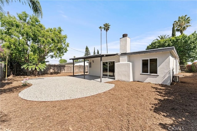 17924 E Kelby St, Covina, CA 91722 - rear view of house featuring a patio area, a chimney, a fenced backyard, and stucco siding