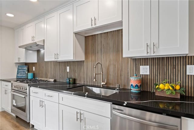 17924 E Kelby St, Covina, CA 91722 - kitchen featuring appliances with stainless steel finishes, under cabinet range hood, a sink, white cabinetry, and recessed lighting