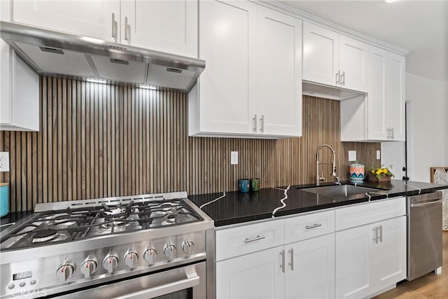17924 E Kelby St, Covina, CA 91722 - kitchen featuring appliances with stainless steel finishes, under cabinet range hood, a sink, white cabinetry, and decorative backsplash