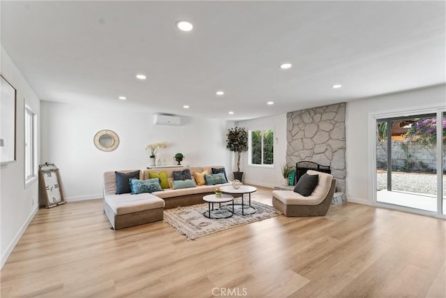 17924 E Kelby St, Covina, CA 91722 - living room with a wall unit AC, plenty of natural light, light wood-type flooring, and recessed lighting