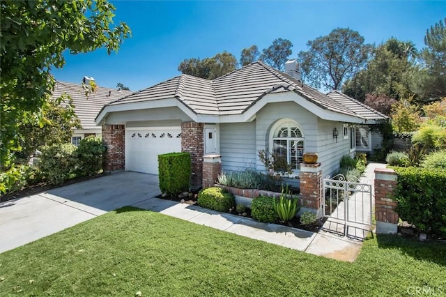 24148 Saint Moritz Dr, Valencia, CA 91355 - ranch-style home featuring a chimney, an attached garage, concrete driveway, brick siding, and a gate