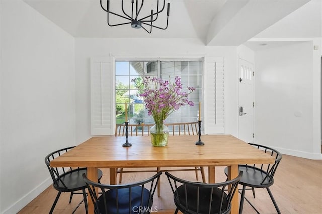 24148 Saint Moritz Dr, Valencia, CA 91355 - dining space featuring baseboards, a chandelier, and light wood finished floors