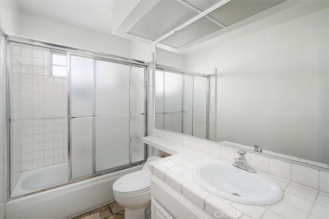 24148 Saint Moritz Dr, Valencia, CA 91355 - bathroom with toilet, vanity, and shower / bath combination with glass door