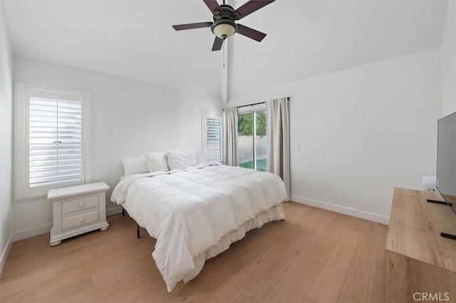 24148 Saint Moritz Dr, Valencia, CA 91355 - bedroom featuring access to outside, light wood-type flooring, baseboards, vaulted ceiling, and ceiling fan