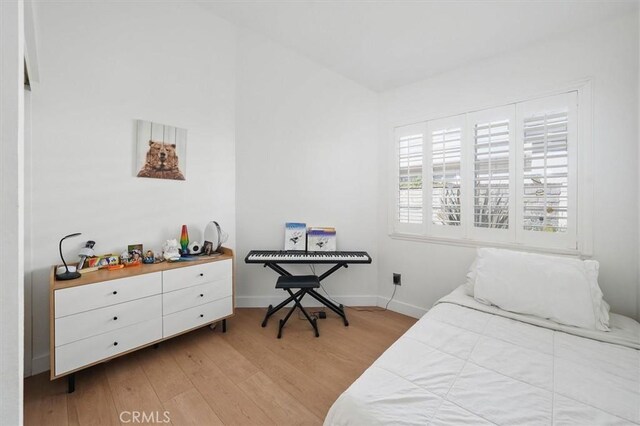 24148 Saint Moritz Dr, Valencia, CA 91355 - bedroom with light wood-style flooring and baseboards