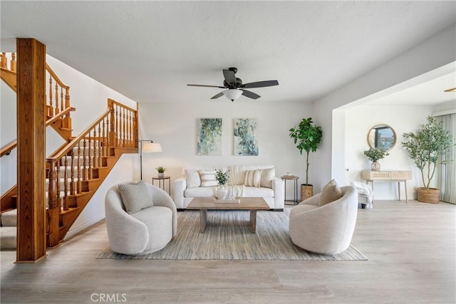 319 Calle Cuervo, San Clemente, CA 92672 - living area featuring wood finished floors, stairway, and ceiling fan