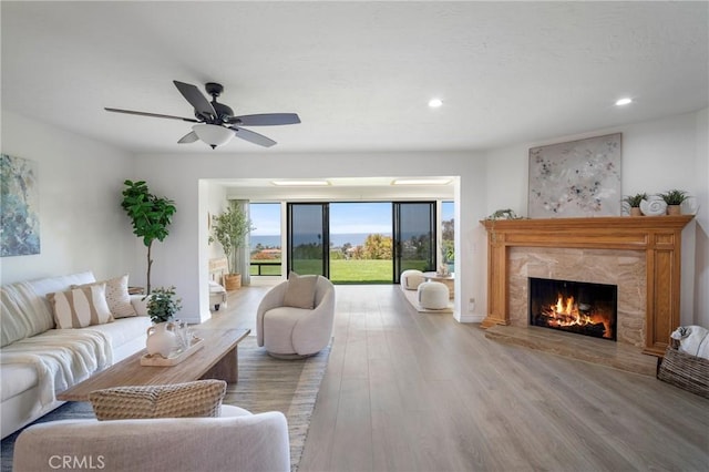 319 Calle Cuervo, San Clemente, CA 92672 - living room featuring wood finished floors, a high end fireplace, recessed lighting, and ceiling fan