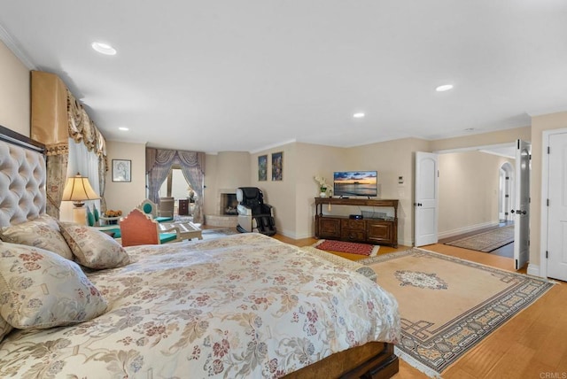 10310 Fuerte Dr, La Mesa, CA 91941 - bedroom featuring wood finished floors, recessed lighting, crown molding, and arched walkways