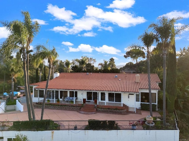 10310 Fuerte Dr, La Mesa, CA 91941 - view of front facade featuring a tiled roof, a patio, and a fenced front yard