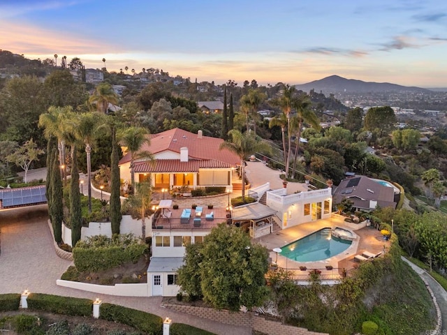 10310 Fuerte Dr, La Mesa, CA 91941 - aerial view at dusk of view of pool and a mountain view