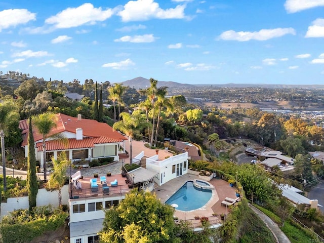 10310 Fuerte Dr, La Mesa, CA 91941 - view of subject property featuring a pool and a mountain backdrop