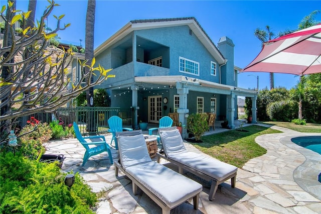 2934 Remy, Burbank, CA 91504 - back of house with a patio area, stucco siding, a balcony, and an outdoor pool