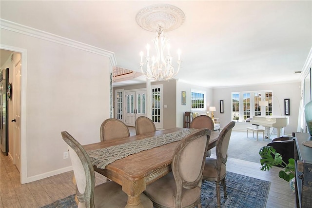 2934 Remy, Burbank, CA 91504 - dining space with a chandelier, light wood-type flooring, crown molding, and baseboards
