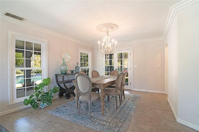 2934 Remy, Burbank, CA 91504 - dining area with baseboards, a chandelier, crown molding, and wood finished floors